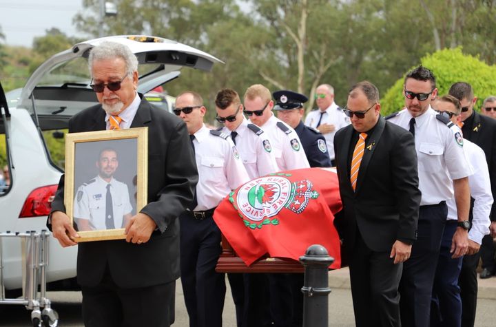 With hand on heart, Australian firefighters mourn colleague