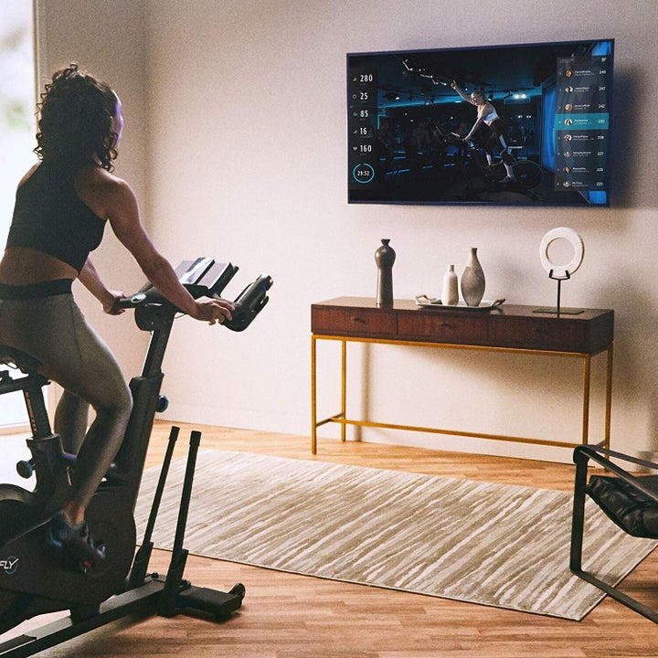 The Flywheel Home Bike in action: The deal includes a free two-month subscription to cycling and strength workouts.