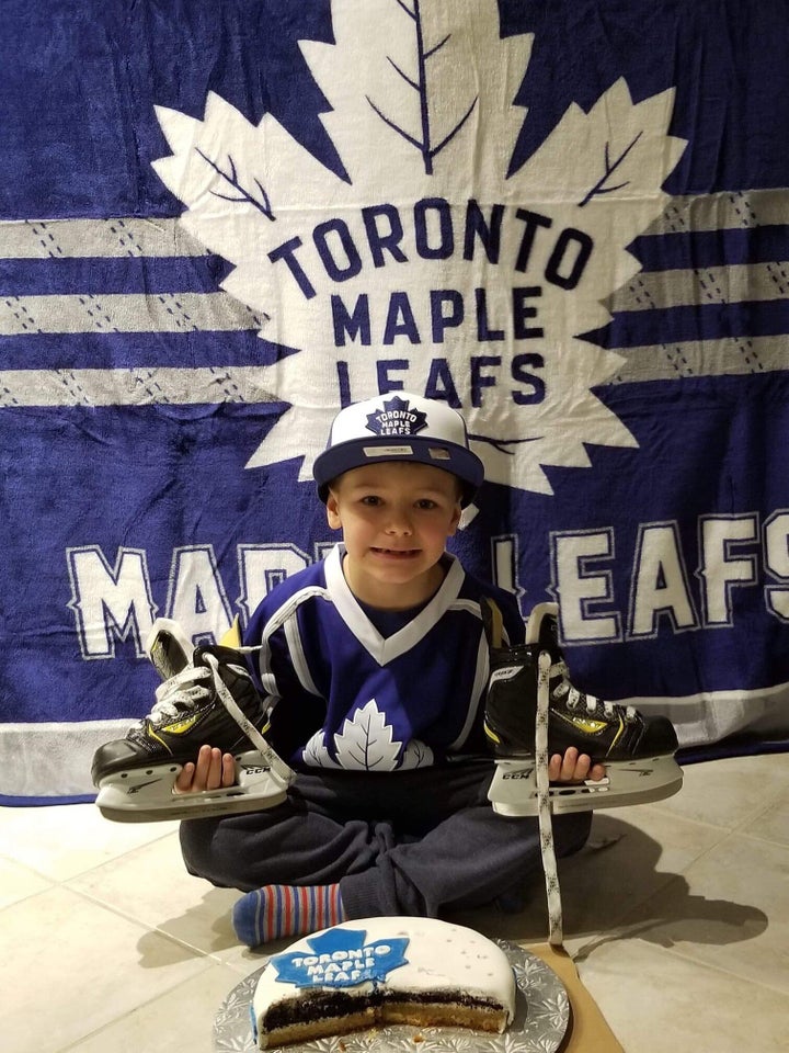 Jacob at a previous birthday party, with the right kind of 'Maple Leafs' cake.