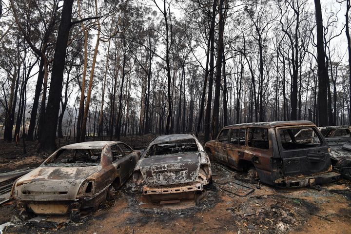 Charred vehicles that were gutted by bushfires in Mogo Village, New South Wales, are seen on Monday.