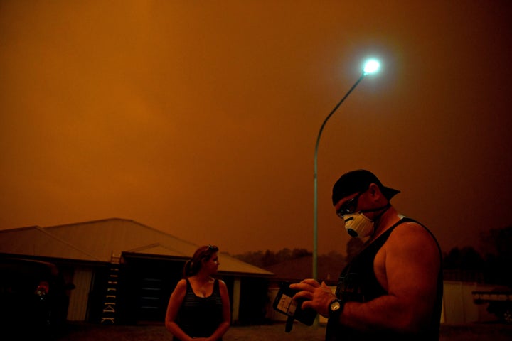 Locals use phone apps to get updates on the fire and to anticipate its movements as high winds push smoke and ash from the Currowan Fire towards Nowra, New South Wales, Australia January 4, 2020. REUTERS/Tracey Nearmy