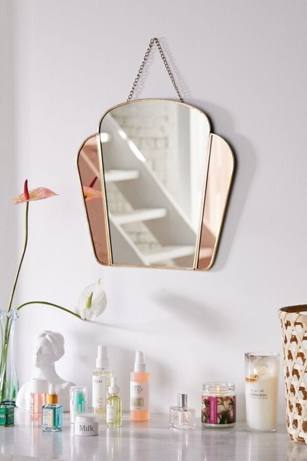 You can look back to the past with this Art Deco-inspired mirror. <a href="https://fave.co/35sUMT3" target="_blank" role="link" class=" js-entry-link cet-external-link" data-vars-item-name="Find this mirror at Urban Outfitters" data-vars-item-type="text" data-vars-unit-name="5e14b68ec5b66361cb5b7569" data-vars-unit-type="buzz_body" data-vars-target-content-id="https://fave.co/35sUMT3" data-vars-target-content-type="url" data-vars-type="web_external_link" data-vars-subunit-name="article_body" data-vars-subunit-type="component" data-vars-position-in-subunit="29"><strong>Find this mirror at Urban Outfitters</strong></a>.