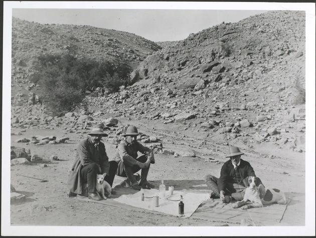 Oil mining pioneers at a picnic near Masjid i-Suleiman in Persia (Iran) with their dogs, circa 1900.