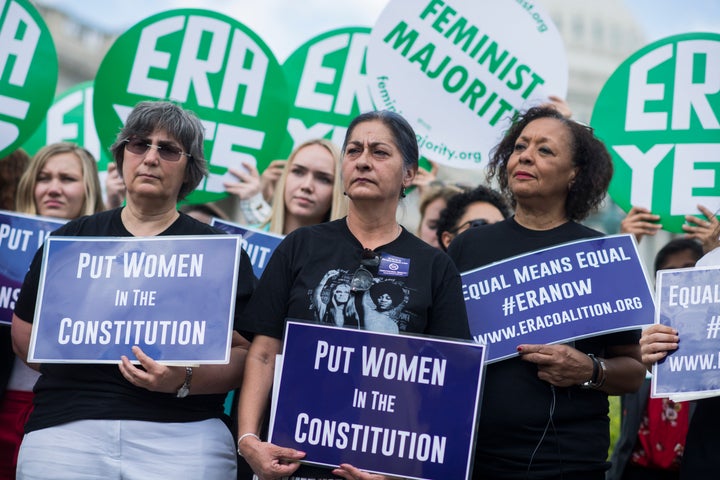 Jessica Lenahan, center, a domestic violence survivor, and Carol Jenkins, right, of the Equal Rights Amendment Task Force, attend a news conference at the House Triangle on the need to ratify the Equal Rights Amendment on June 6, 2018.