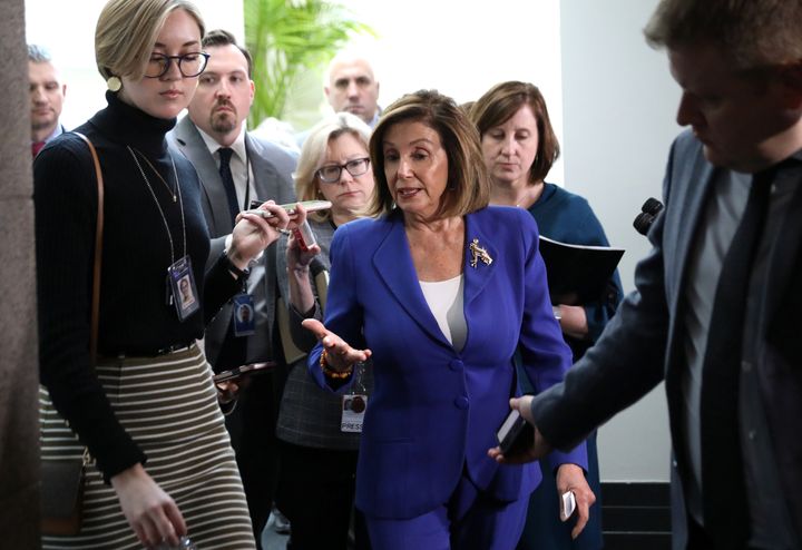 U.S. House Speaker Nancy Pelosi answers questions from reporters after leaving a House Democratic caucus meeting on Capitol Hill in Washington, U.S., January 8, 2020. REUTERS/Leah Millis