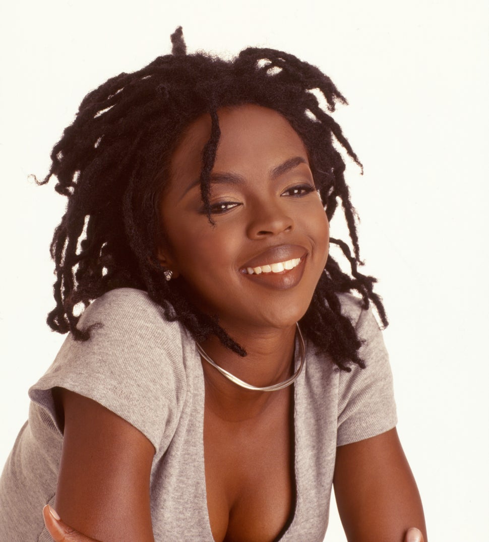 Portrait of American pop and rhythm & blues musician Lauryn Hill as she poses against a white background, 1998.