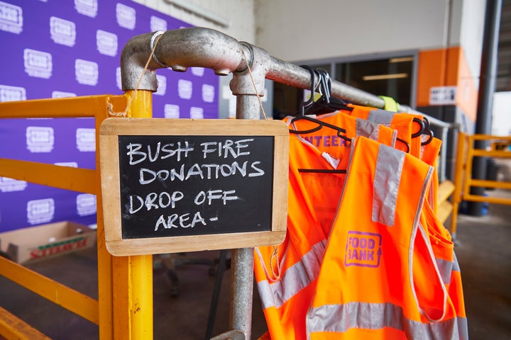  A sign shows the public where to unload donated goods at the Food Bank Distribution Centre bound for areas impacted by bushfires on January 07, 2020 in the Glendenning suburb of Sydney, Australia.