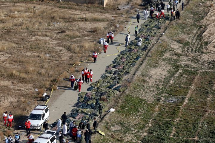 Bodies of the victims of a Ukrainian plane crash are collected by rescue team at the scene of the crash in Shahedshahr, southwest of the capital Tehran, Iran.