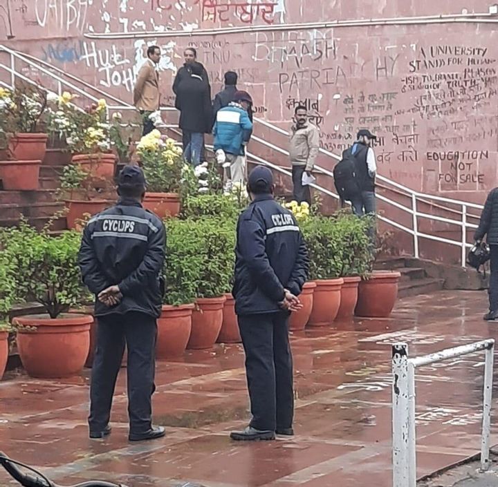 JNU security guards from Cyclops at the administrative block on campus, three days after the violence. Vice Chancellor Mamidala Jagadesh Kumar is second from left on the stairs.