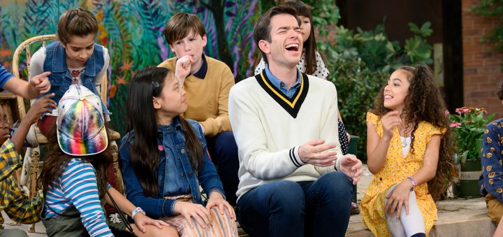 Mulaney with the cast.