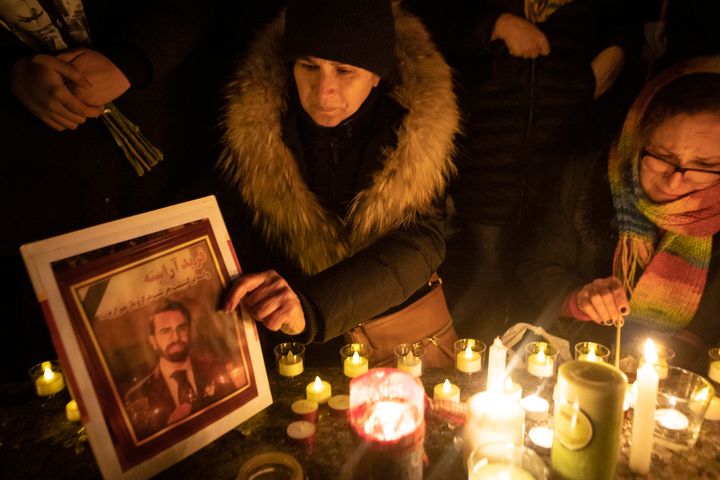 A photograph is placed at a memorial during a vigil in Toronto, Thursday, Jan. 9, 2020, to remember the victims.