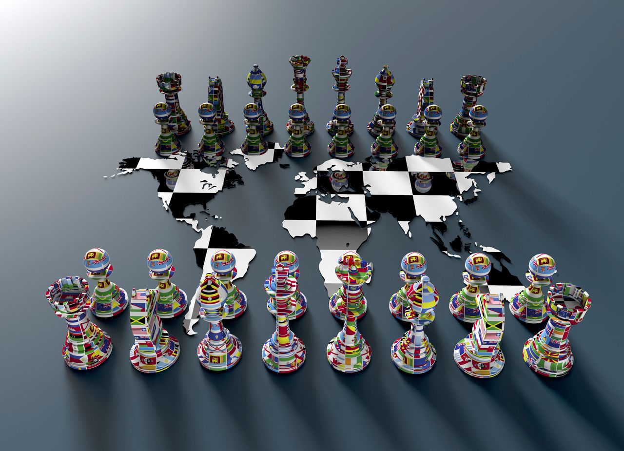 symbol of geopolitics, chess board out of the world map with chess play made of country flags
