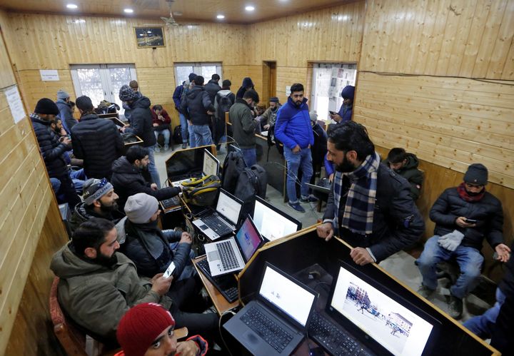 Journalists use the internet as they work inside a government-run media center in Srinagar on January 10, 2020.