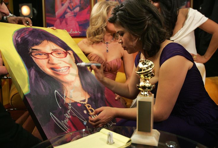 America Ferrera signs a piece by pop artist Nicolosi after winning a Golden Globe Award for Best Performance by an Actress in a Television Series - Musical or Comedy on Jan. 15, 2007.
