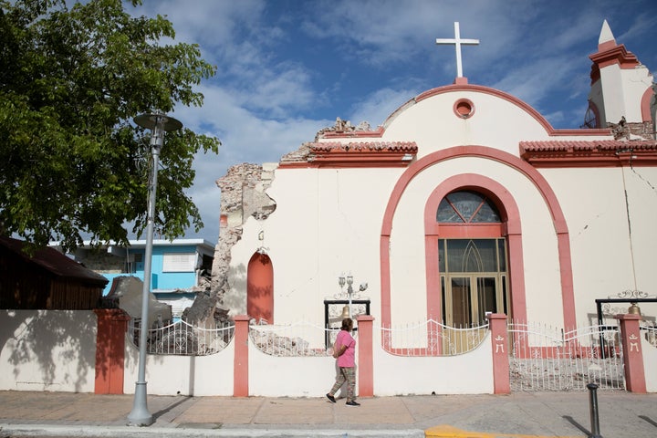 A woman walks in front of a damaged church after the earthquake in Guayanilla, Puerto Rico, January 9, 2020.