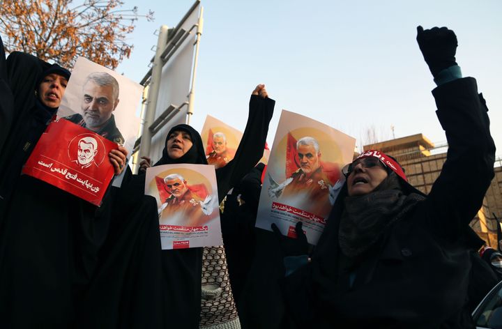 Dozens of protestors gather outside the British embassy in Tehran on Sunday. 