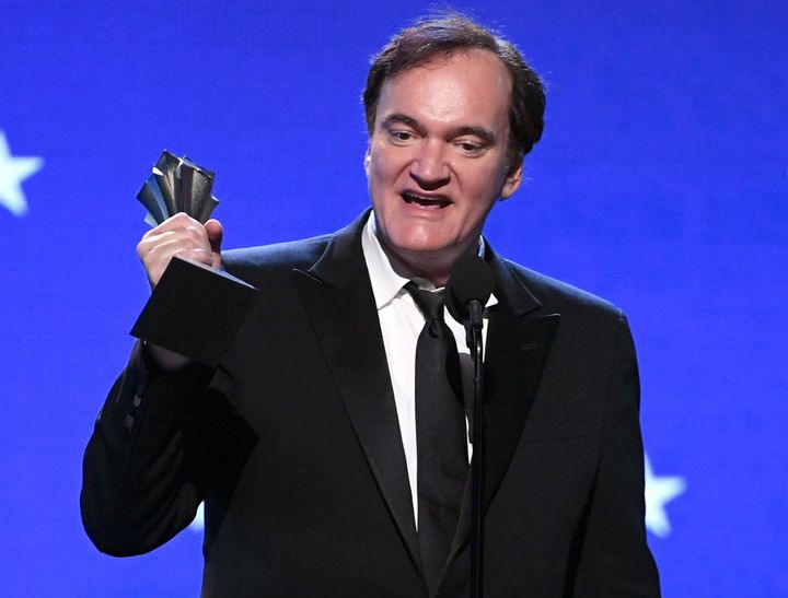Quentin Tarantino accepts the Best Supporting Actor award for 'Once Upon a Time... in Hollywood on behalf of Brad Pitt during the 25th Annual Critics' Choice Awards.