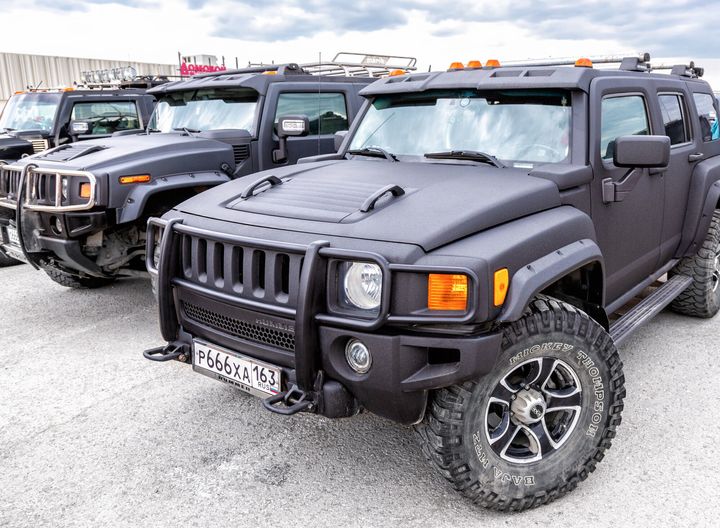 Samara, Russia - May 18, 2019: Black luxury Hummer cars parking at the city street