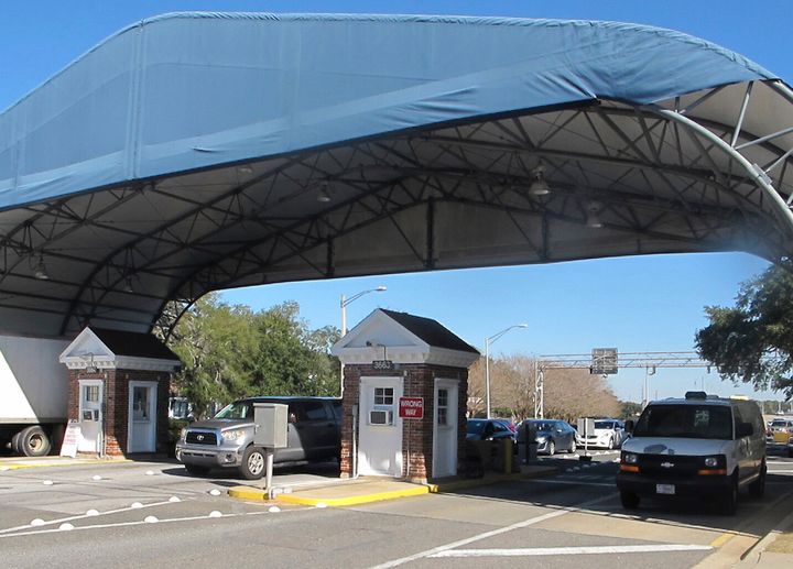 FILE- In this Jan. 29, 2016 file photo shows the entrance to the Naval Air Base Station in Pensacola, Fla.