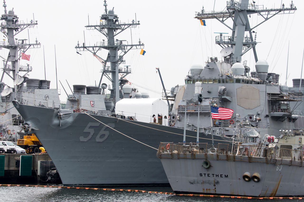 The USS John S. McCain destroyer is moored out of sight in Japan on June 1, 2019, after the White House and Defense Department exchanged emails on hiding the ship during Trump's visit so he wouldn't be enraged by seeing the name of his rival. 