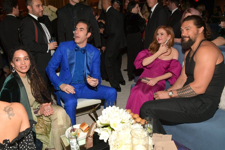 Jason Momoa (right, pictured with Lisa Bonet, Sacha Baron Cohen and Isla Fisher) later reappeared in the tank top at a Golden Globes after-party.