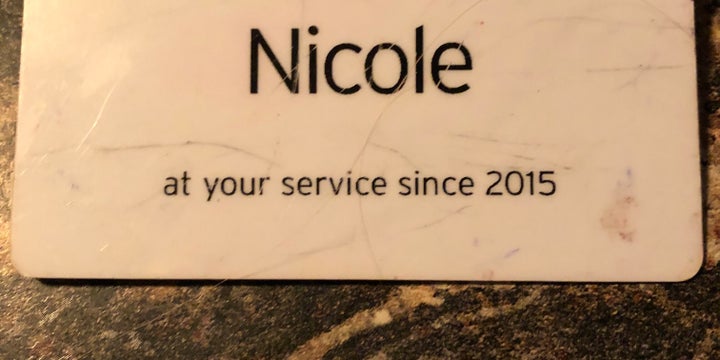 The name tag Nicole Johnson wore while working at a grocery store.