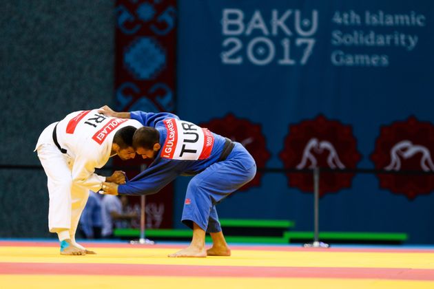 Saeid Mollaei (in white) of Iran and Gulduren Ilker (in blue) of Turkey compete for the men's judo 81kg gold medal in 2017.