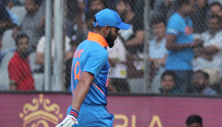 Virat Kohli walks back after losing his wicket during the first one-day international match between India and Australia in Mumbai, January 14, 2020. 