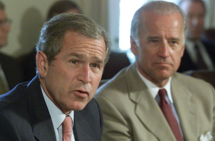 Then-Sen. Joe Biden (D-Del.), right, supported deposing Iraqi leader Saddam Hussein in 2003 while George W. Bush was president.