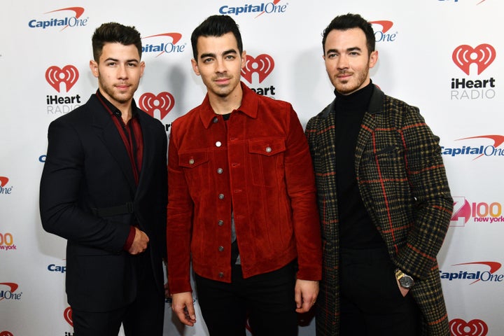 Nick Jonas, Joe Jonas and Kevin Jonas attend Z100's iHeartRadio Jingle Ball in New York City.