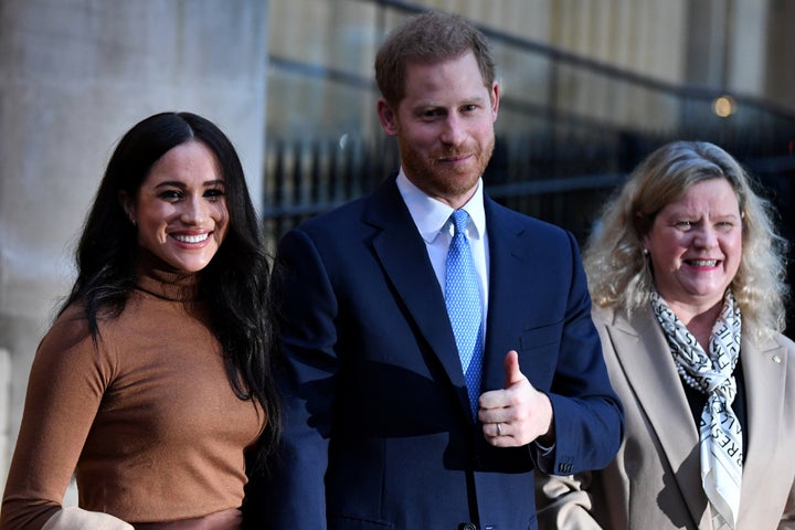 The Duke and Duchess of Sussex stand with High Commissioner for Canada in the United Kingdom Janice Charette as they leave after their visit to Canada House in London on Jan. 7, 2020. 