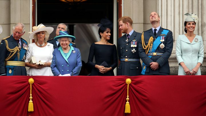 Charles, Camilla, Duchess of Cornwall, Queen Elizabeth, Meghan, Duchess of Sussex, Prince Harry, Prince William, and Catherine, Duchess of Cambridge, stand on the balcony of Buckingham Palace on July 10, 2018.