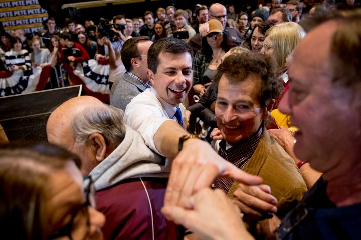 Democratic presidential candidate Pete Buttigieg (center) greets members of the audience during a campaign stop at Iowa State University on Jan. 13, 2020, in Ames, Iowa.