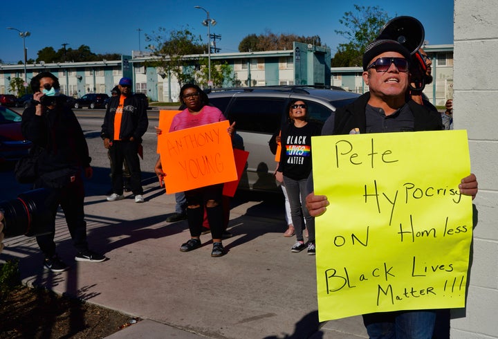 Activists with Black Lives Matter protest Pete Buttigieg's visit to a Bridge Home Project homeless shelter in Los Angeles on Jan. 10, 2020.