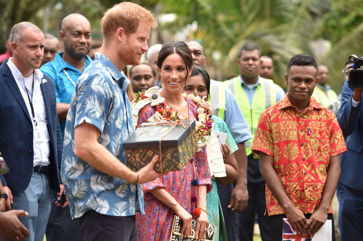 The royal couple receive a gift from the University of the South Pacific after Meghan recounts her own struggles to afford her university degree.