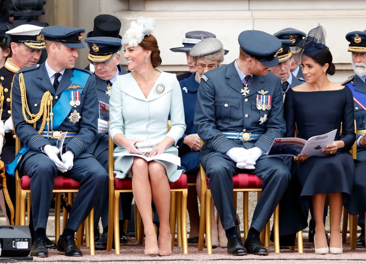 Prince William, Duke of Cambridge; Catherine, Duchess of Cambridge; Prince Harry, Duke of Sussex and Meghan, Duchess of Sussex attend a ceremony to mark the centenary of the Royal Air Force on the forecourt of Buckingham Palace on July 10, 2018, in London, England.