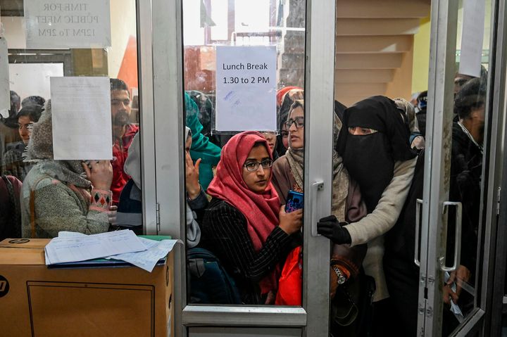 In this photo taken on November 26, 2019, Kashmiri students wait for their turn to use the internet at the Divisional Commissioner's office in Srinagar.