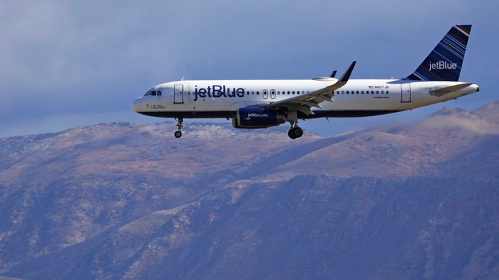 JetBlue's efforts to reduce in-flight waste include a recycling program to sort and recycle bottles and cans served on domestic flights.