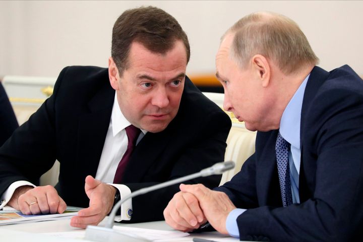 Russian President Vladimir Putin listens to Dmitry Medvedev during the State Council meeting on the agricultural policy at the Kremlin in Moscow, Russia. December 26, 2019.