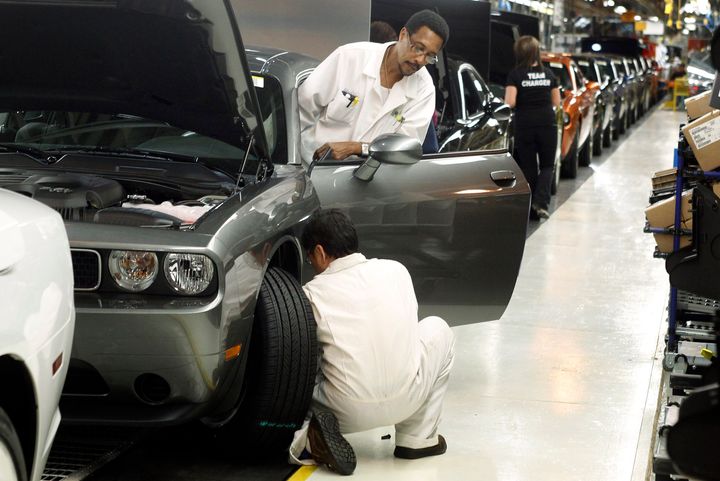 In this Jan. 7, 2011 file photo, employees work on the Chrysler assembly line in Brampton, Ont. A new StatCan study has found the decline of manufacturing jobs has had a significant negative impact on men's employment.