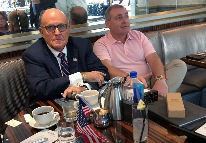 U.S. President Trump's personal lawyer Rudy Giuliani has coffee with Ukrainian-American businessman Lev Parnas at the Trump International Hotel in Washington, U.S. September 20, 2019. REUTERS/Aram Roston