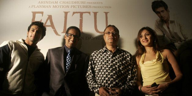From left to right, actor Yash Pandit, producer Arindam Chaudhuri, director Anjan Das and actress Manjari Fadnis pose for a photograph at a press conference held to announce the release of their new Bengali film Faltu in New Delhi, on Thursday Feb 9, 2006.