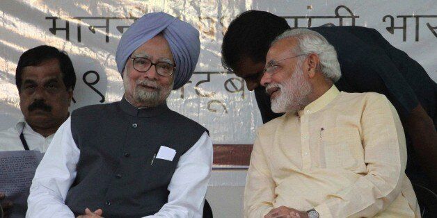 Indian Prime Minister Manmohan Singh, second left, and Gujarat state chief Minister Narendra Modi, right, interact during the inauguration of the renovated memorial of Sardar Vallabhbhai Patel, one of the founding fathers of the Indian republic, in Ahmadabad, India, Tuesday, Oct. 29, 2013. Modi is the opposition Bharatiya Janata Party's (BJP) prime ministerial candidate for the 2014 general elections. (AP Photo/Ajit Solanki)