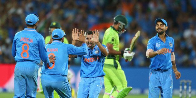 Mohammed Shami of India celebrates with his teammates after dismissing Wahab Riaz of Pakistan during the 2015 ICC Cricket World Cup match.