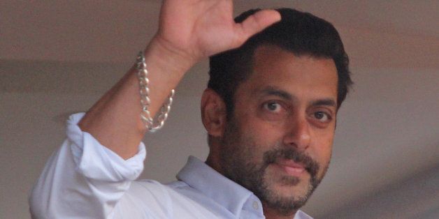 Bollywood actor Salman Khan greets fans from the balcony of his residence in Mumbai, India, Friday, May 8, 2015. A court on Friday granted bail to Khan, one of India's biggest movie stars until it hears his appeal challenging his conviction in a drunk-driving hit-and-run case more than a decade ago. (AP Photo)