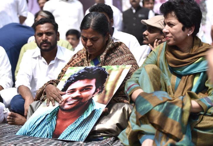 Radhika Vemula with her son's photograph at a protest at Jantar Mantar, New Delhi, on March 2, 2016.