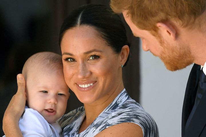 Meghan Markle, the Duchess of Sussex, holds her son, Archie, as Prince Harry, Duke of Sussex, looks on in Cape Town, South Africa, on Sept. 25, 2019.
