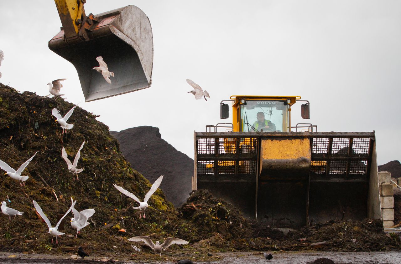 A dozer continuously crawls over the organic waste in order to speed up the decomposition process at the organic waste recycling facility in Richmond, B.C. on June 3, 2013.