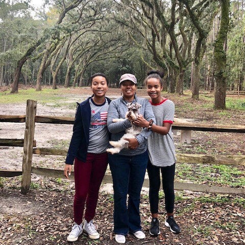 Chapman and her daughters Makayla (left) and Ashley (right), along with the family dog, Lucky, on vacation to Savannah, Ga. in November 2018.
