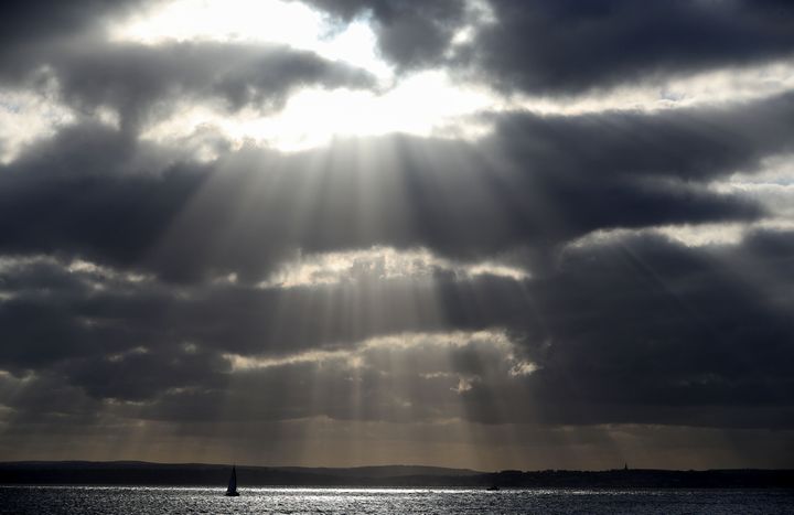 A sailing boat makes its way along the Solent near to Southsea in Hampshire, as temperatures are expected to drop below freezing this weekend, prompting health officials to warn that the chilly conditions can be deadly.